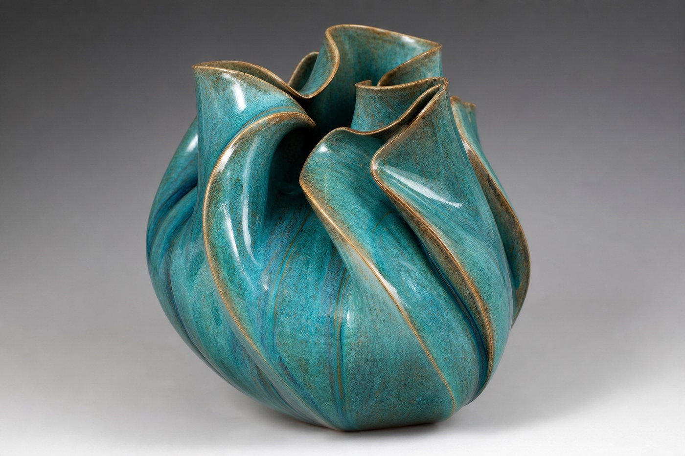 Large sculptural vessel with teal-dipped glaze finish